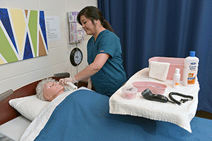 Female student practicing vital signs