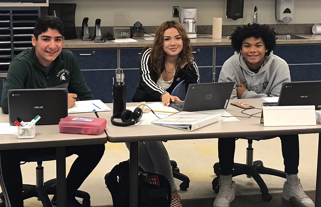 Three Career Learning Center students sitting at a table