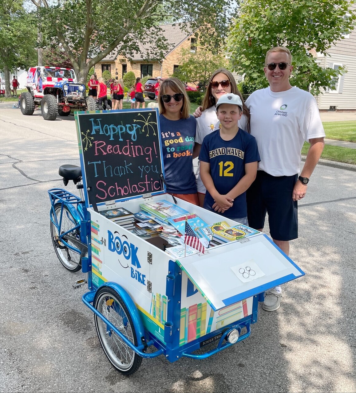 Kyle Mayer with the book bike and his family